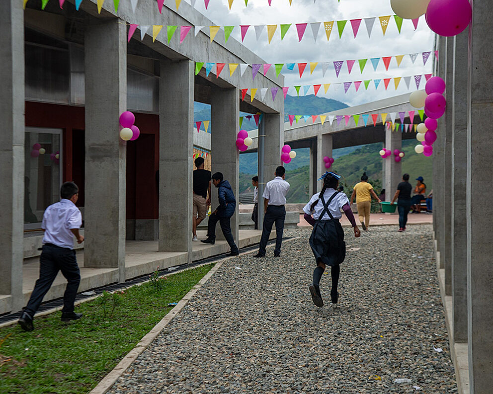 Kids run around the new school